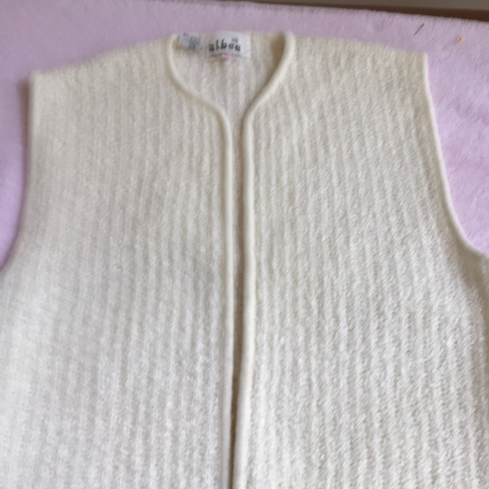 S/less. 100% acrylic cardigan. Hand wash.